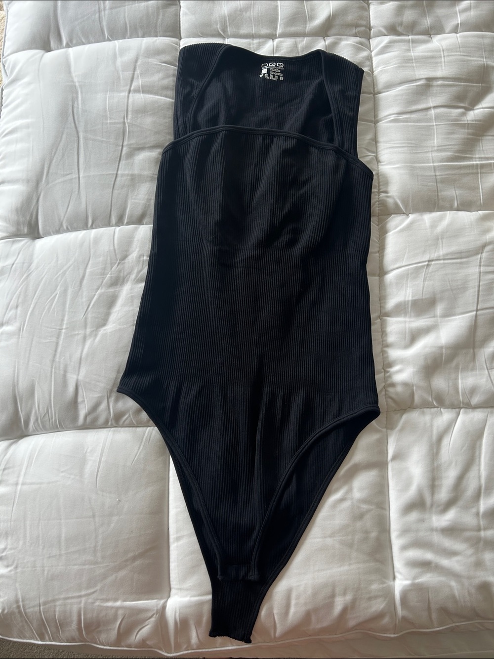 Women’s Black Ribbed One-Piece Bodysuit